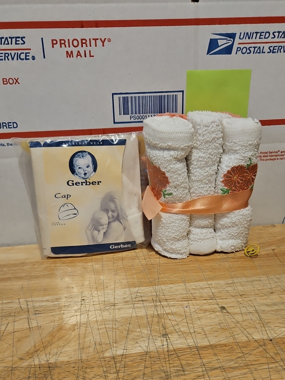 Gerber White Baby Cap, White Burp Cloths~Orange Floral Trim and Milk Bottle.
